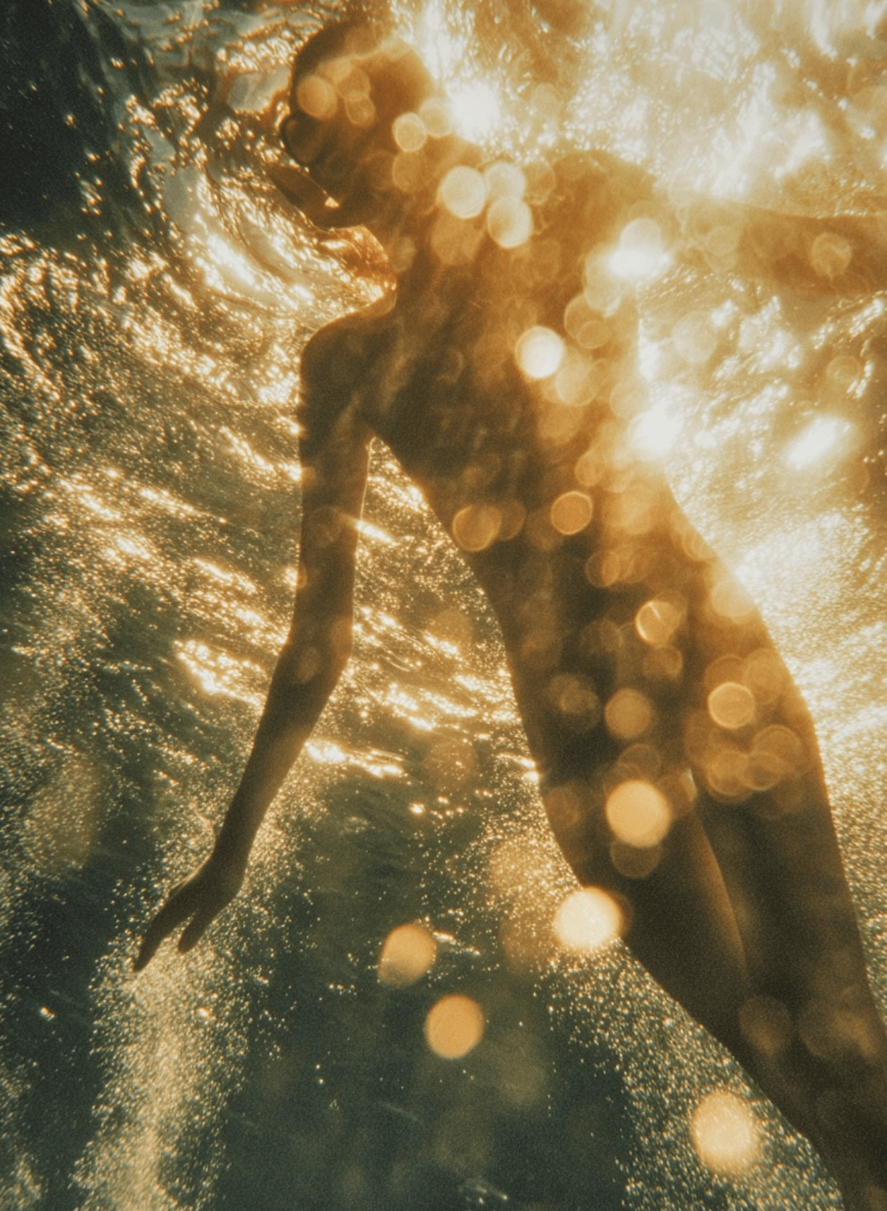 AI-generated underwater figure with golden bokeh