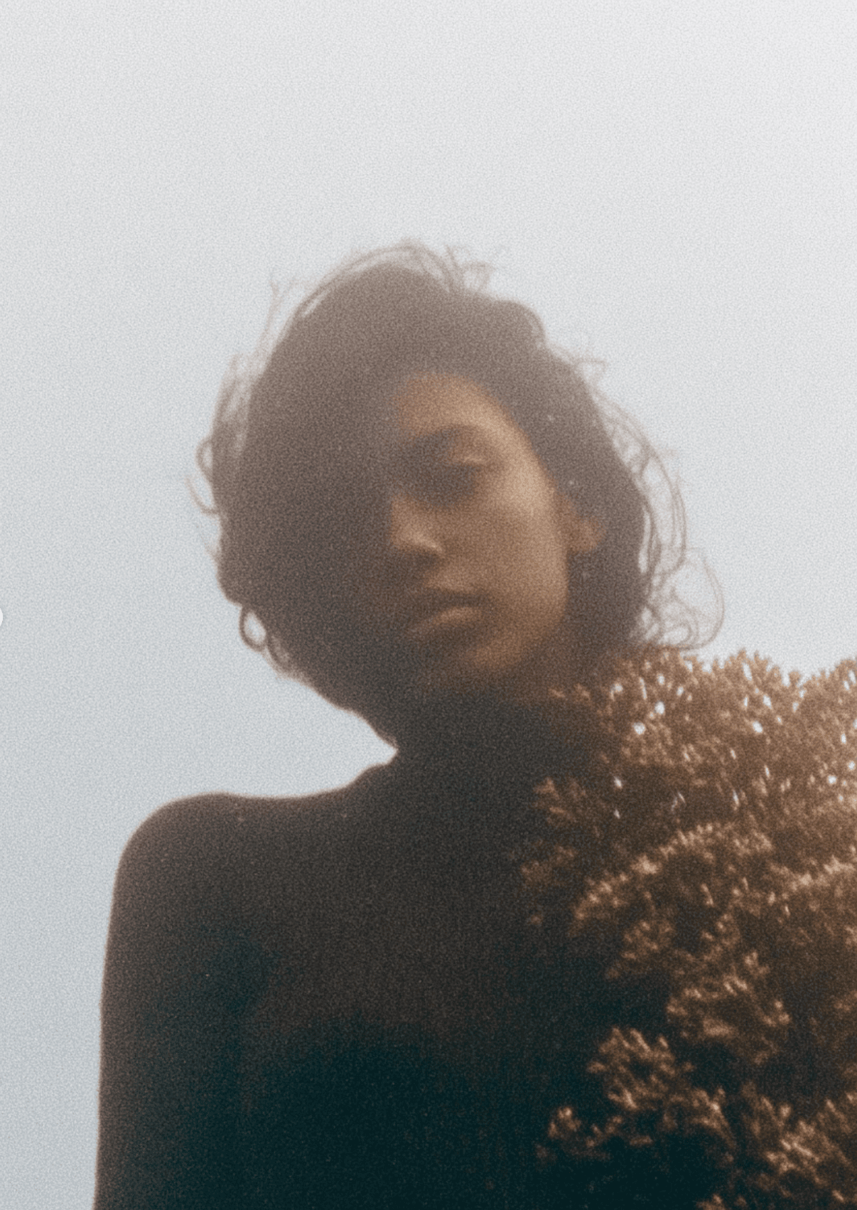 AI-generated portrait with flowers against overcast sky